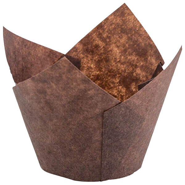 A close-up of a brown paper Novacart tulip baking cup with a folded edge.