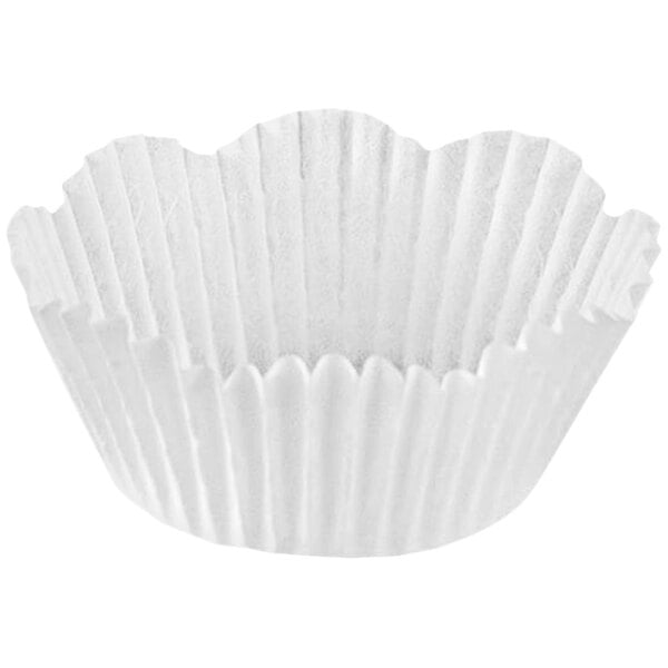 A close up of a white paper cupcake liner with a petal fluted edge.