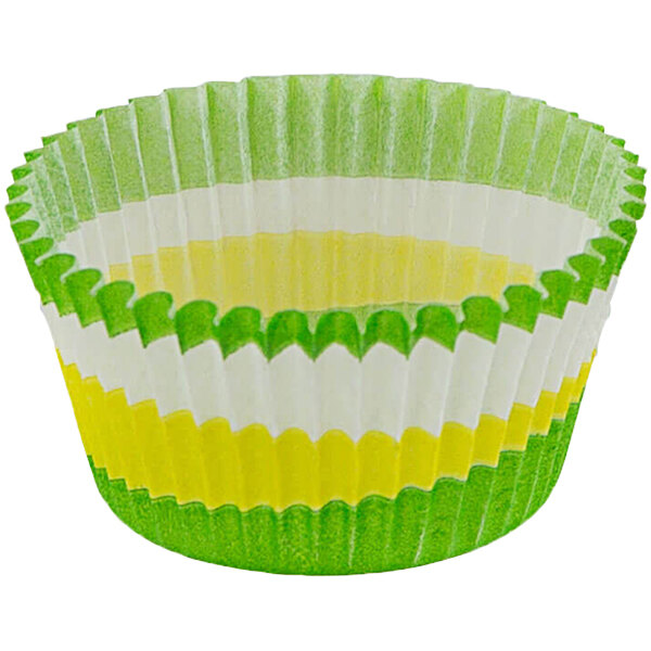 A close up of a Novacart green and yellow fluted baking cup.