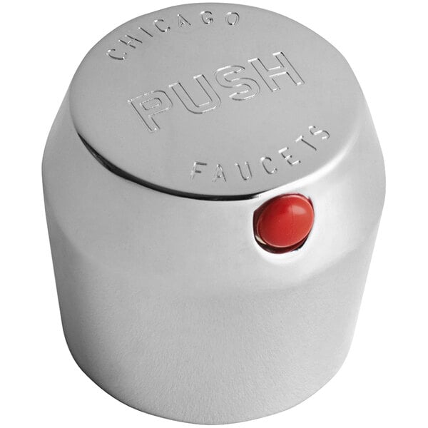 A silver Chicago Faucets MVP metering push handle with a red button.
