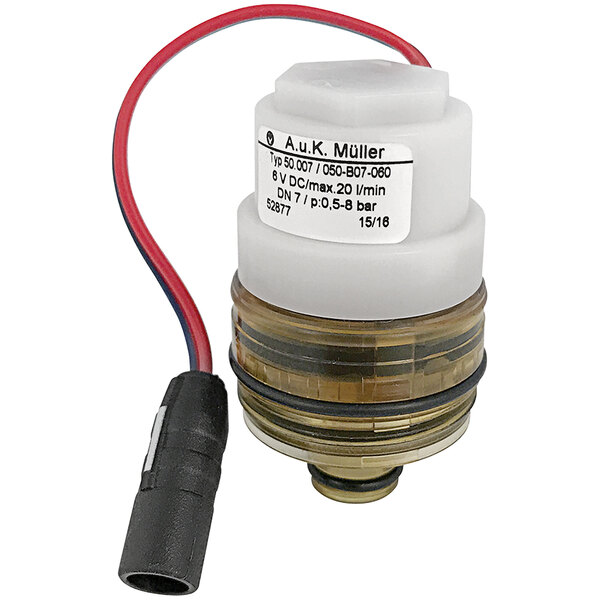 A small round white and red Chicago Faucets electronic solenoid valve with a black wire.