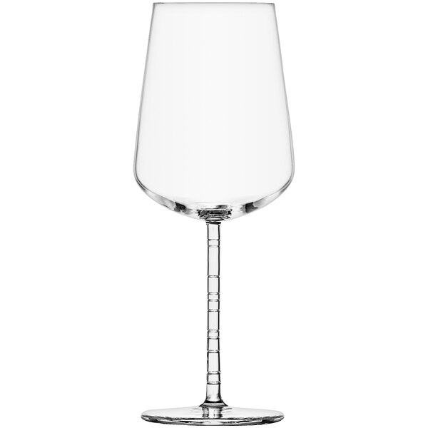 A close-up of a clear Schott Zwiesel wine glass with a stem.