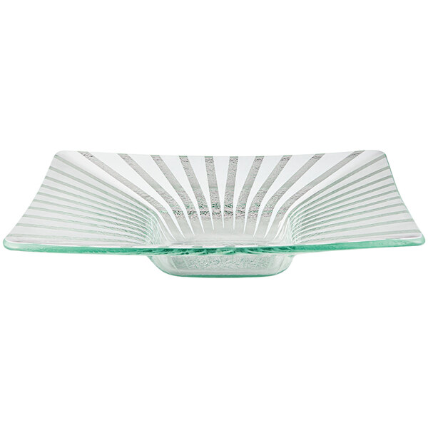 A close-up of a Rosseto white glass bowl with a curved edge.