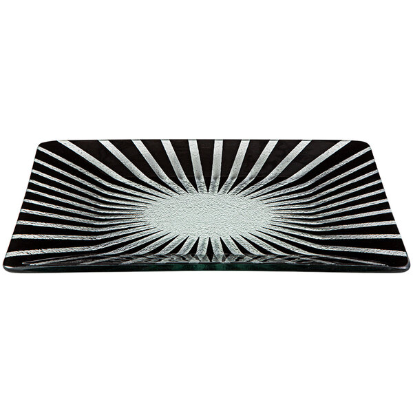 A black glass square platter with a sunburst design in the center.