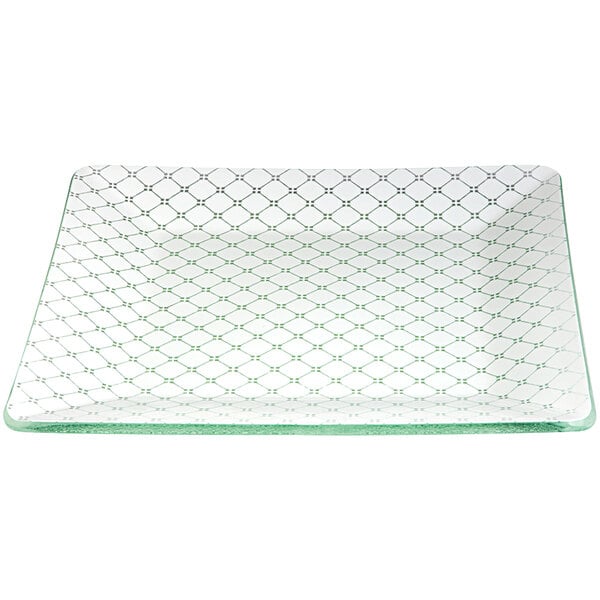 A white glass square platter with green lines.