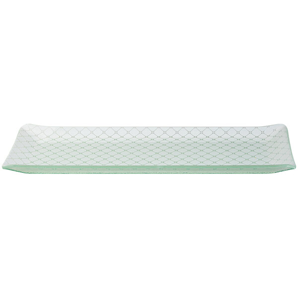 A rectangular white glass tray with a pattern.
