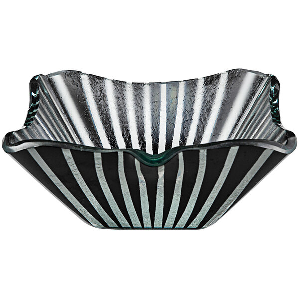A black glass bowl with black and white stripes.