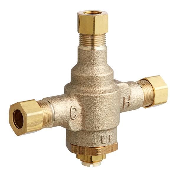 A Stiebel Eltron brass mixing valve with two brass handles.