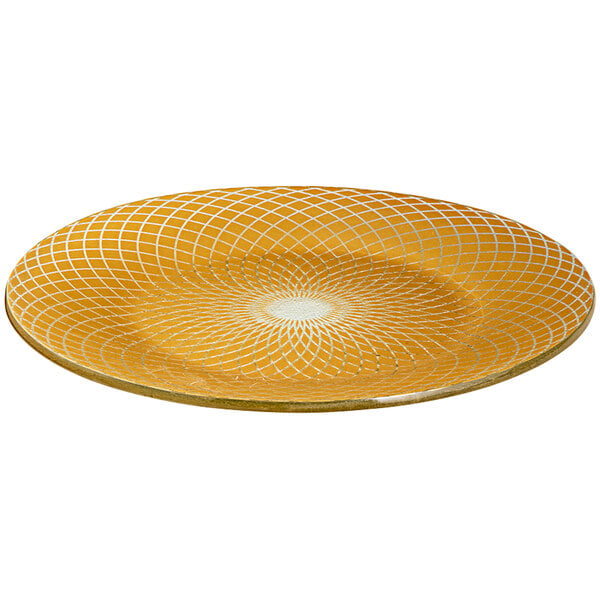 A yellow glass platter with white circular lines on it.