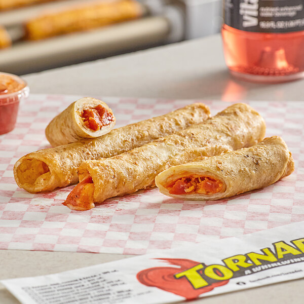 Ruiz Foods Cheese & Pepperoni Tornado Taquitos in a plastic container on a checkered paper.