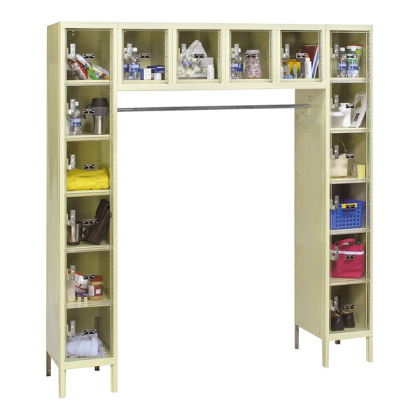 A tan Hallowell box locker with shelves and compartments.