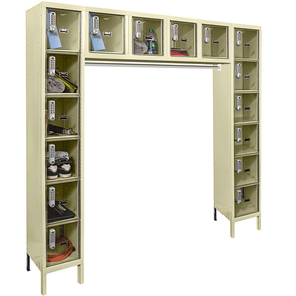 A tan metal box locker with many compartments.