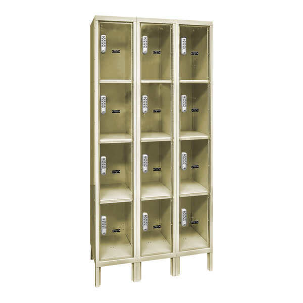 A tan Hallowell box locker with 4 compartments on each of 3 shelves.