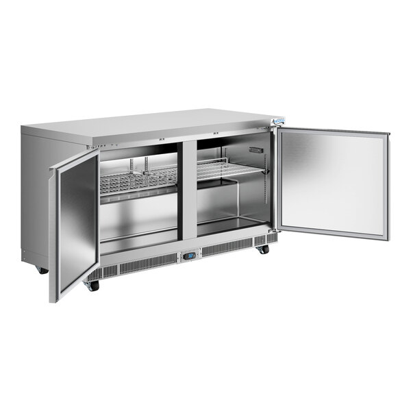 A stainless steel undercounter refrigerator with two open doors and interior shelving.