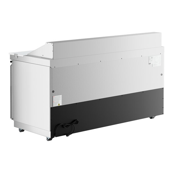 A large, stainless steel, three-door refrigerated sandwich prep table with a cutting top and front breathing design.