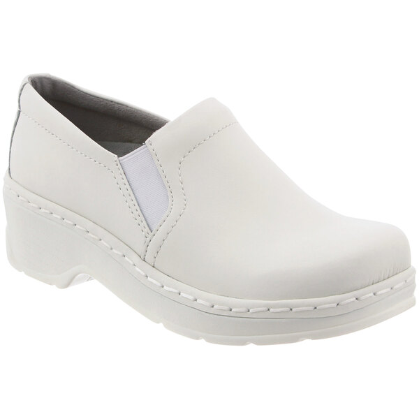 A pair of white leather Klogs women's clogs with a white sole.