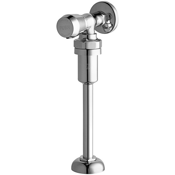 A close-up of a silver Chicago Faucets angled urinal valve with metering push handle.