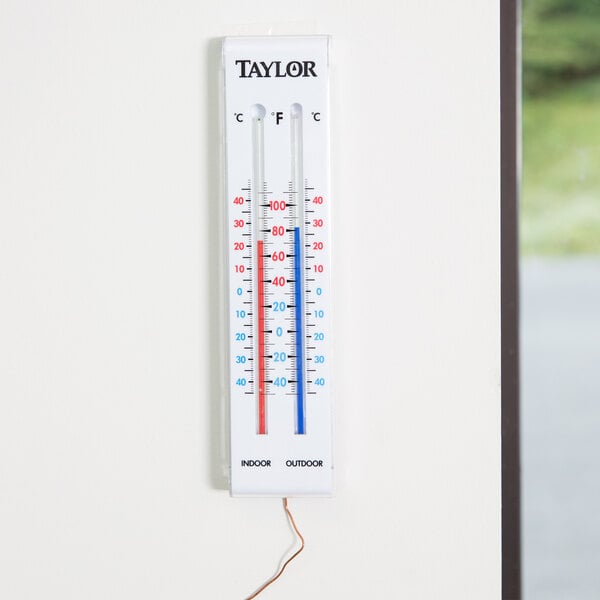 A Taylor 5327 indoor / outdoor thermometer on a wall.