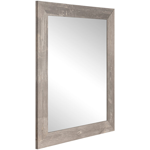 A BrandtWorks rectangular mirror with a gray barnwood frame.