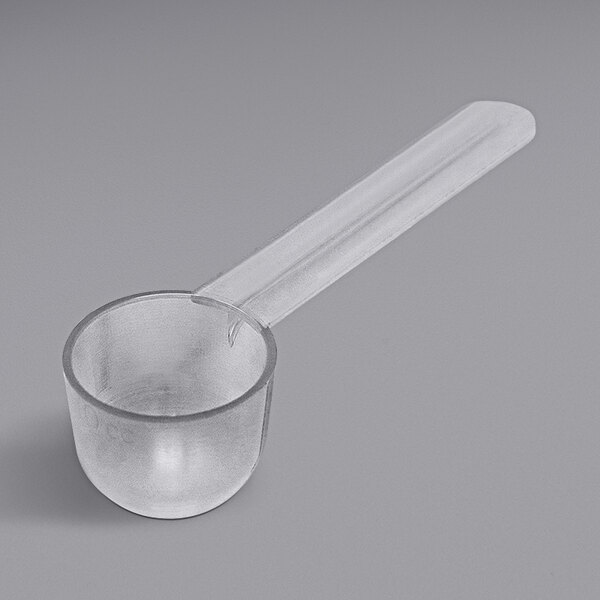 A clear plastic Polypropylene bowl scoop with a long handle.