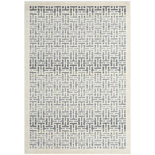 A close up of a gray and white geometric patterned Abani Cabo Collection area rug.