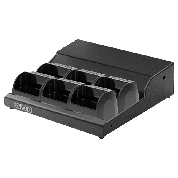 A black plastic Kenwood charger adapter with six compartments.