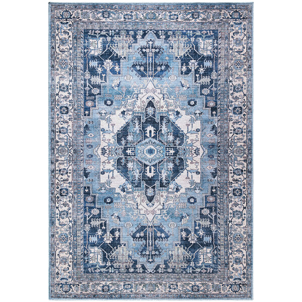 An Abani Molana Collection beige rug with blue and white traditional medallion designs.