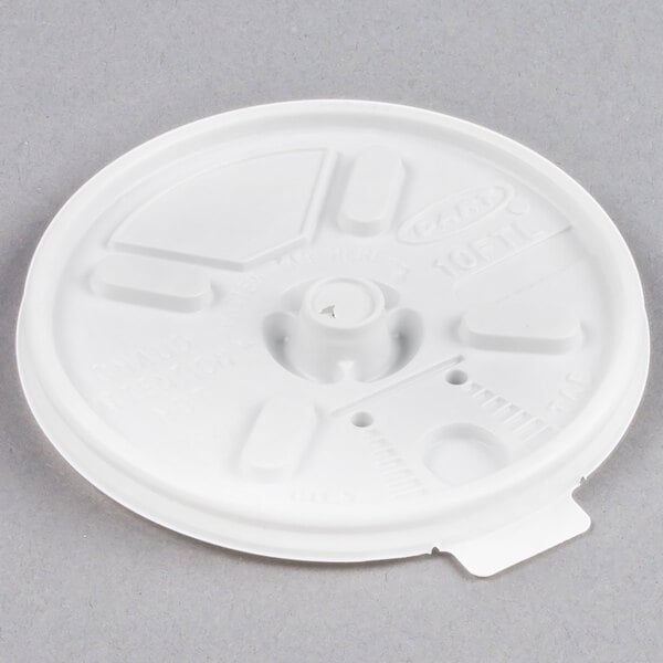 A white plastic Dart Lift'n'Lock lid with three holes.