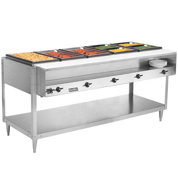 A Vollrath ServeWell electric hot food table with several trays of food.