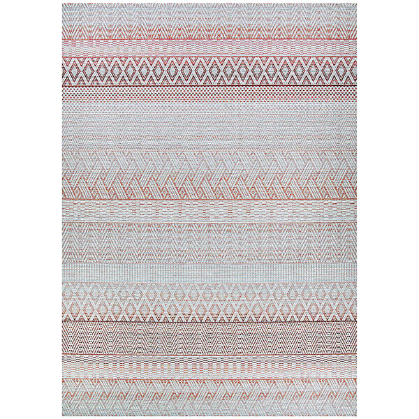 A Couristan area rug with an orange and white geometric pattern on a white background.
