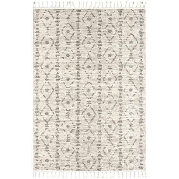 An Abani Layla Collection farmhouse area rug in beige and brown with a diamond pattern and fringes.