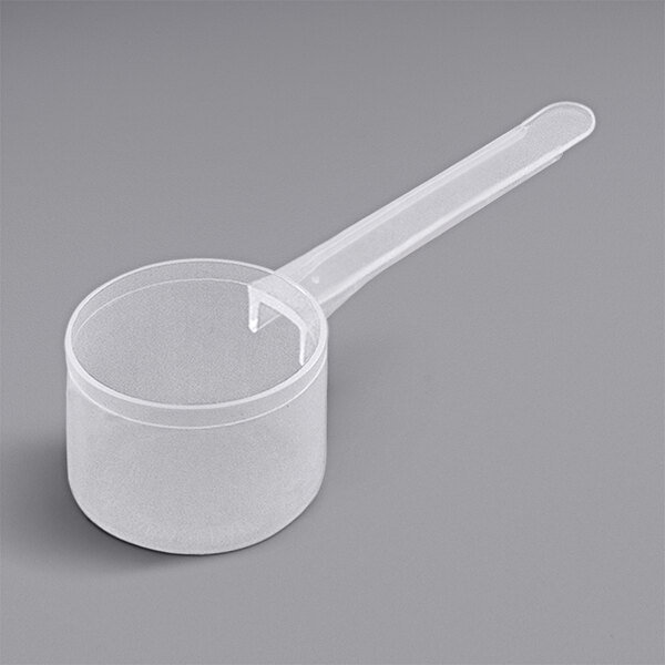 A clear plastic 53 cc Polypropylene scoop with a long handle.