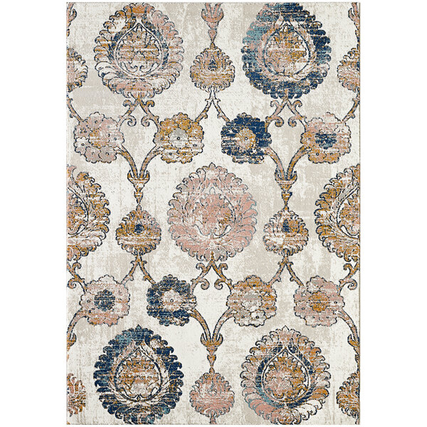 An Abani Arto Collection area rug with a distressed bohemian medallion pattern in beige, blue, and pink.