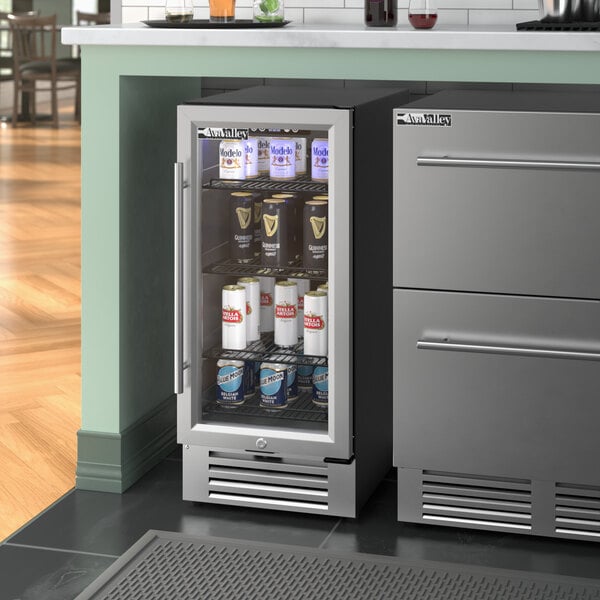 An AvaValley stainless steel beverage refrigerator with full glass door full of cans.