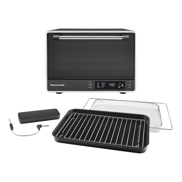 A black KitchenAid countertop oven with a wire tray.