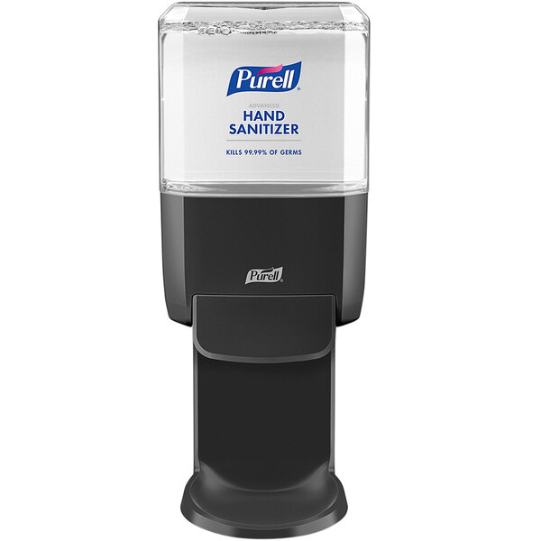 A Purell® hand sanitizer dispenser on a counter.