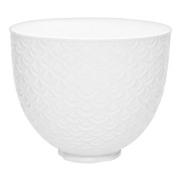 A white KitchenAid ceramic mixing bowl with a mermaid scale pattern.