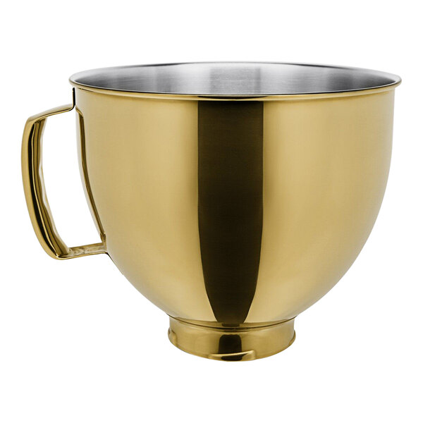 A gold stainless steel KitchenAid mixing bowl with a handle.