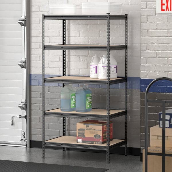 A Lavex black metal boltless shelving unit with bottles of blue liquid and a box on a shelf.