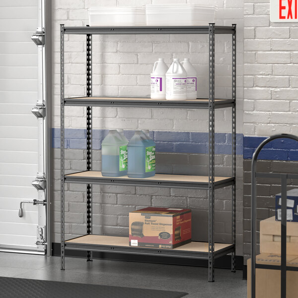 A Lavex black boltless shelving unit holding containers and boxes.