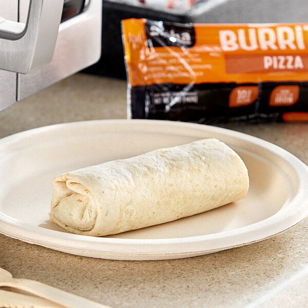 An Alpha Foods Plant-Based Pizza Burrito on a plate next to a microwave.