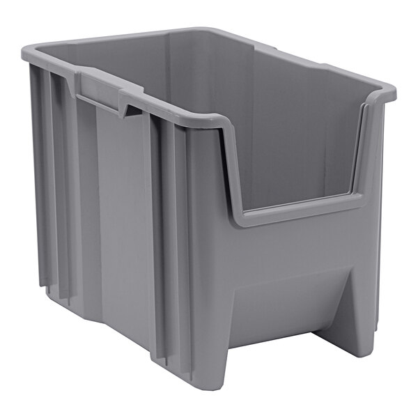 A gray plastic Quantum giant stacking container with a handle.
