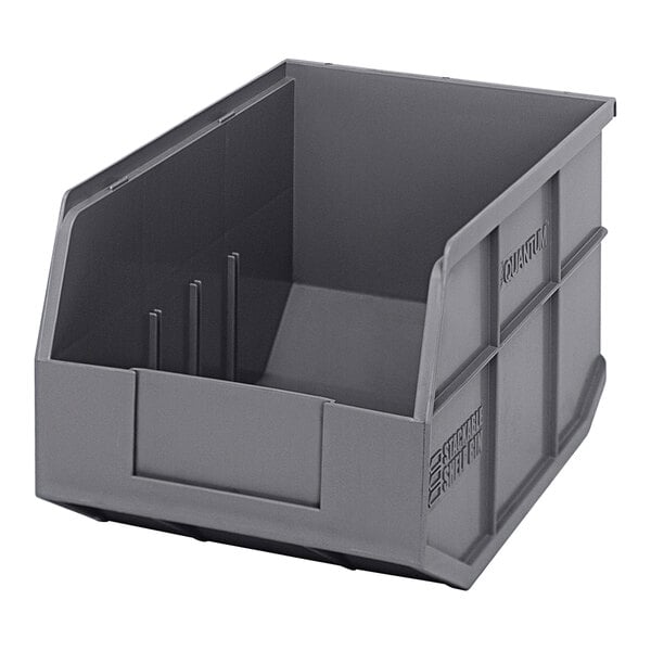 A gray plastic Quantum stackable shelf bin with two compartments.