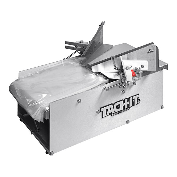 A Tach-It 3350A bag opener machine with plastic bags.