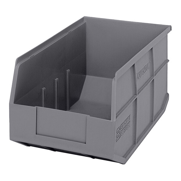 A gray plastic Quantum shelf bin with two compartments.