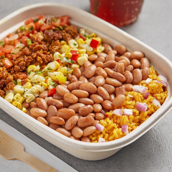 A container of dried pinto beans, corn, and rice.