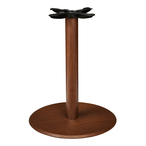 A round wooden column base for a table.