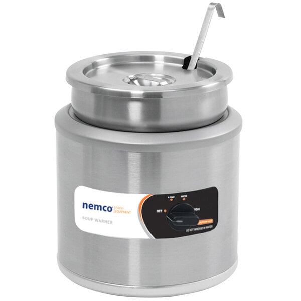 A Nemco countertop food warmer with a lid on a counter.