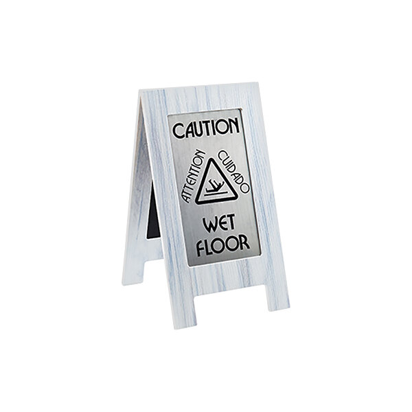 A Cal-Mil white-washed wet floor sign on a white surface.