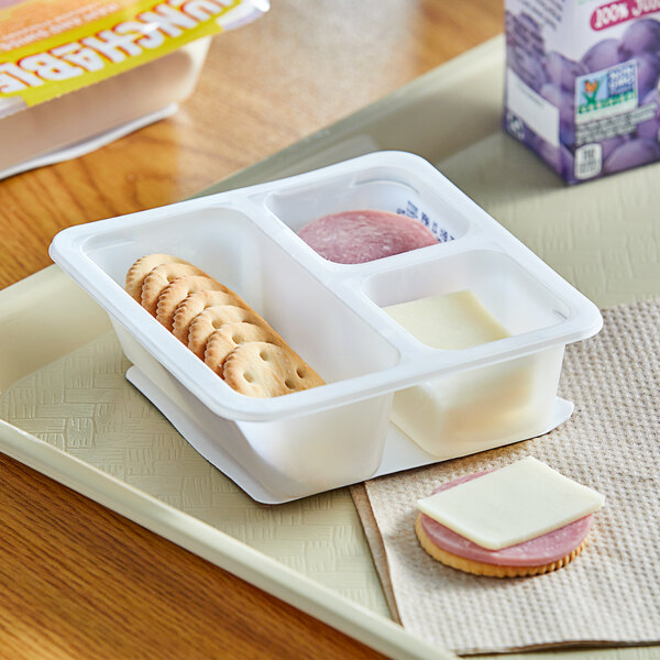 A Lunchables tray with crackers, ham, and cheese.